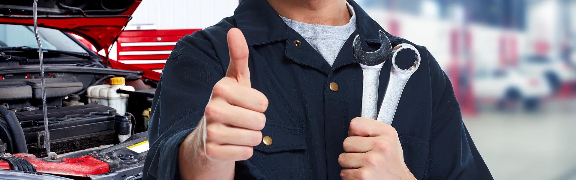 service tech thumbs up holding tools